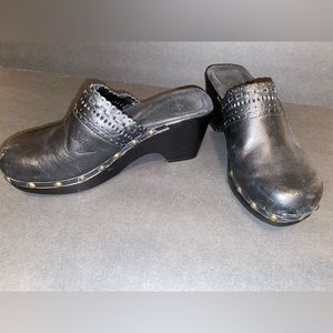 Black leather clogs